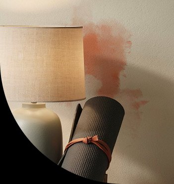 A styled lamp and rolled yoga mat